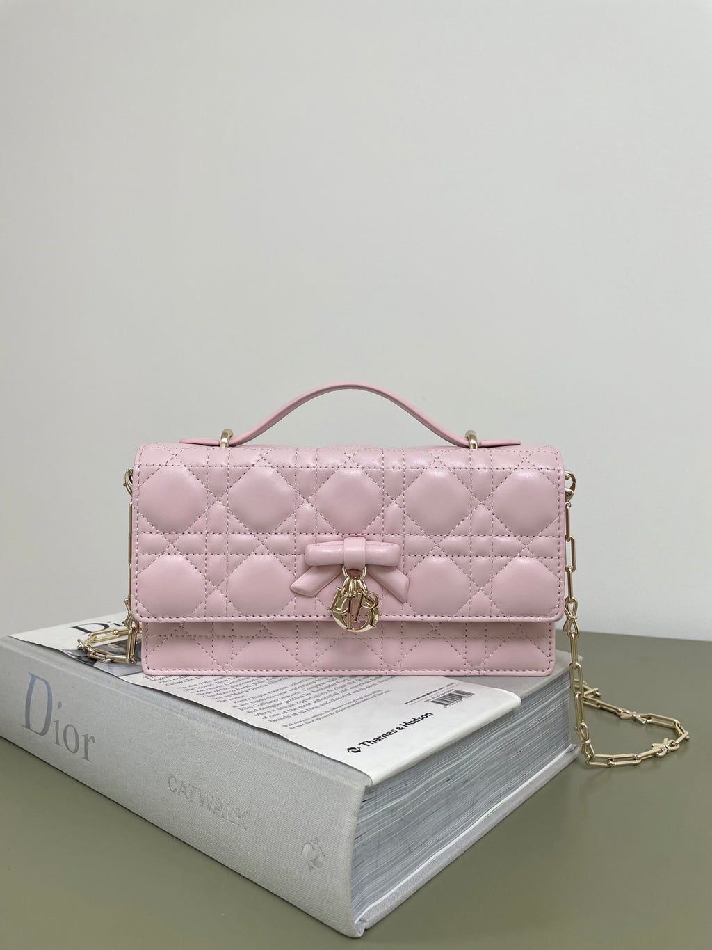 Dior quilted pink leather shoulder bag with top handle and gold chain strap