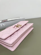 Pink quilted Dior wallet bag with front flap and gold logo clasp