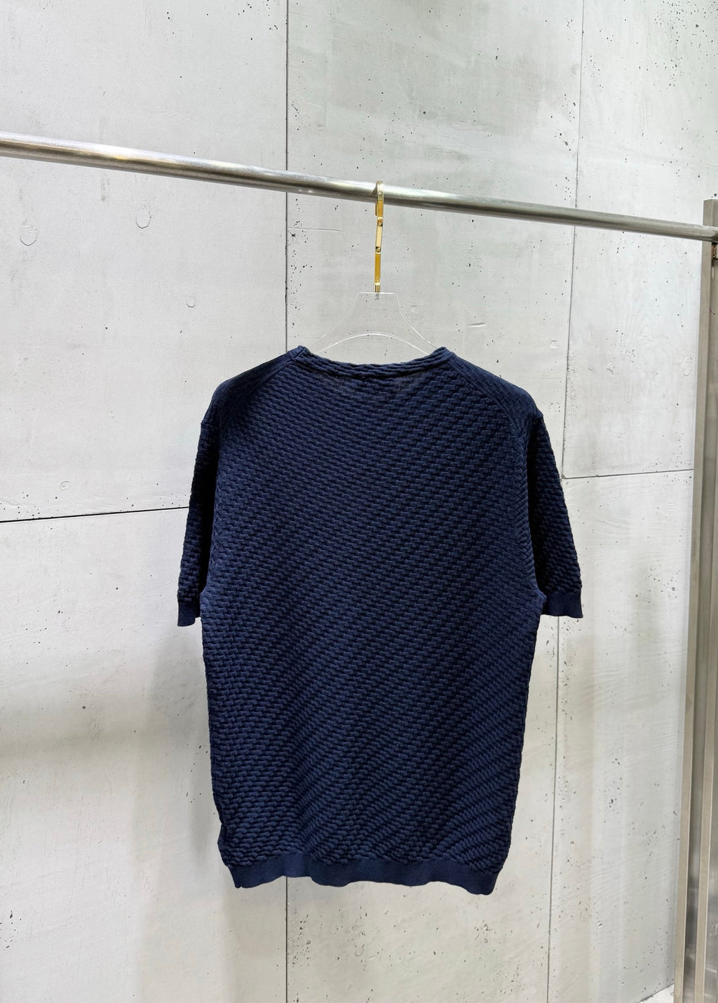 Dark blue knit T-shirt with crew neck and three-quarter length sleeves