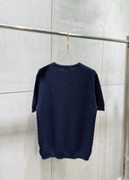 Dark blue knit T-shirt with crew neck and three-quarter length sleeves