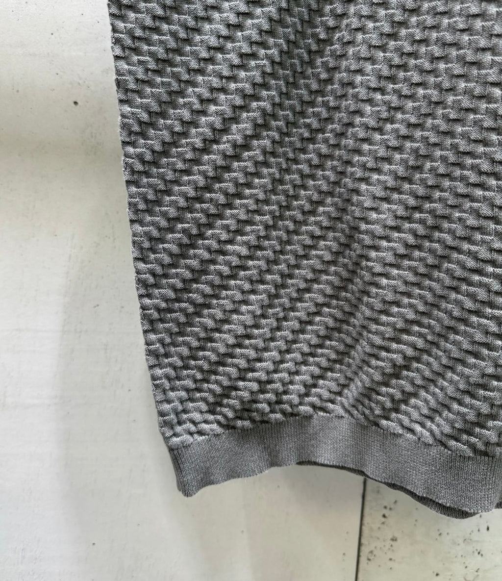 Amiri knit sweater hem and cuff in heather gray with ribbed trim.