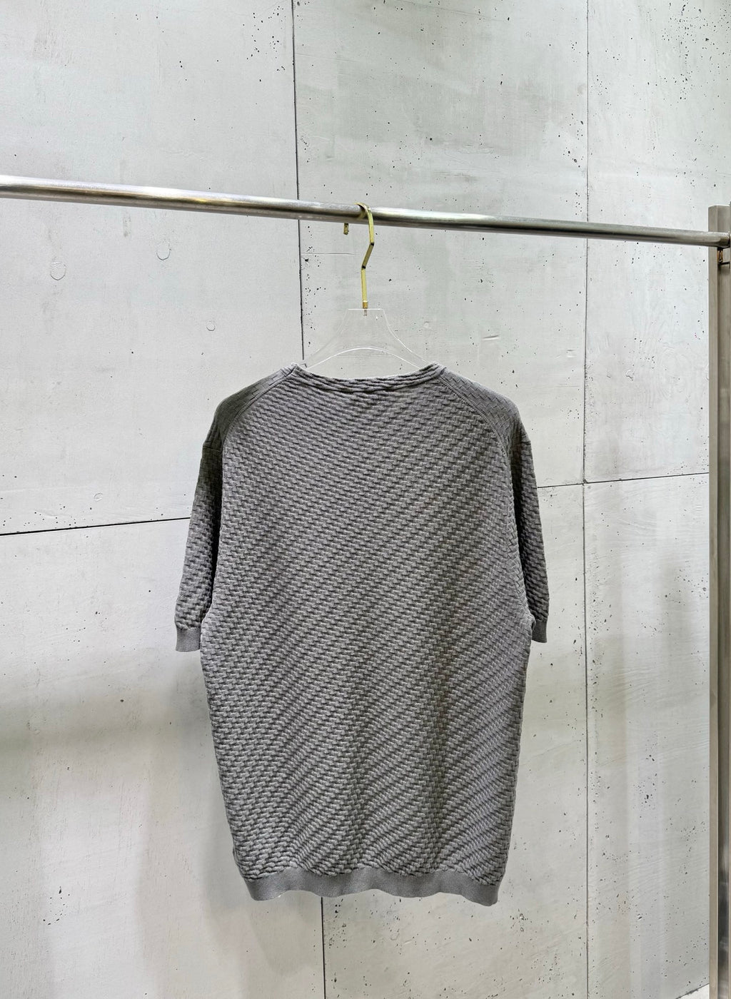 Amiri knit sweater back view in heather gray with crew neck.