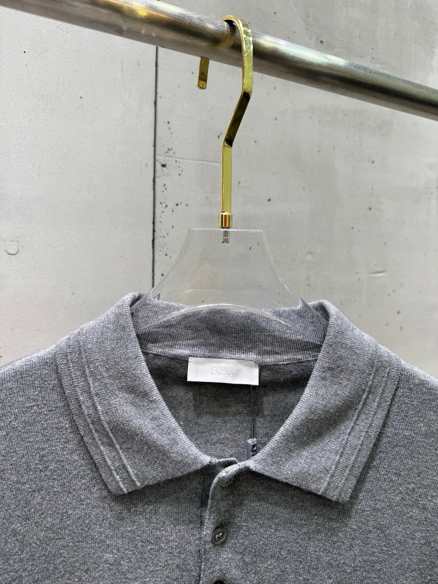 Prada polo shirt close-up neckline, heather gray ribbed collar with button placket