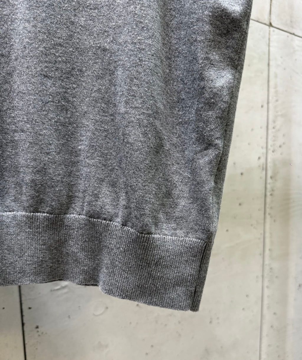 Prada polo shirt sleeve and hem detail, heather gray knit with ribbed bottom cuff
