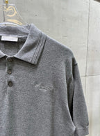 Prada polo shirt close-up, heather gray knit with embroidered “Christian Dior Couture” logo