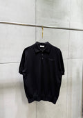 Black short-sleeve polo shirt with button placket and embroidered logo