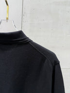Black polo shirt shoulder seam and high ribbed collar