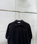 Black short-sleeve polo shirt with pointed collar and front buttons