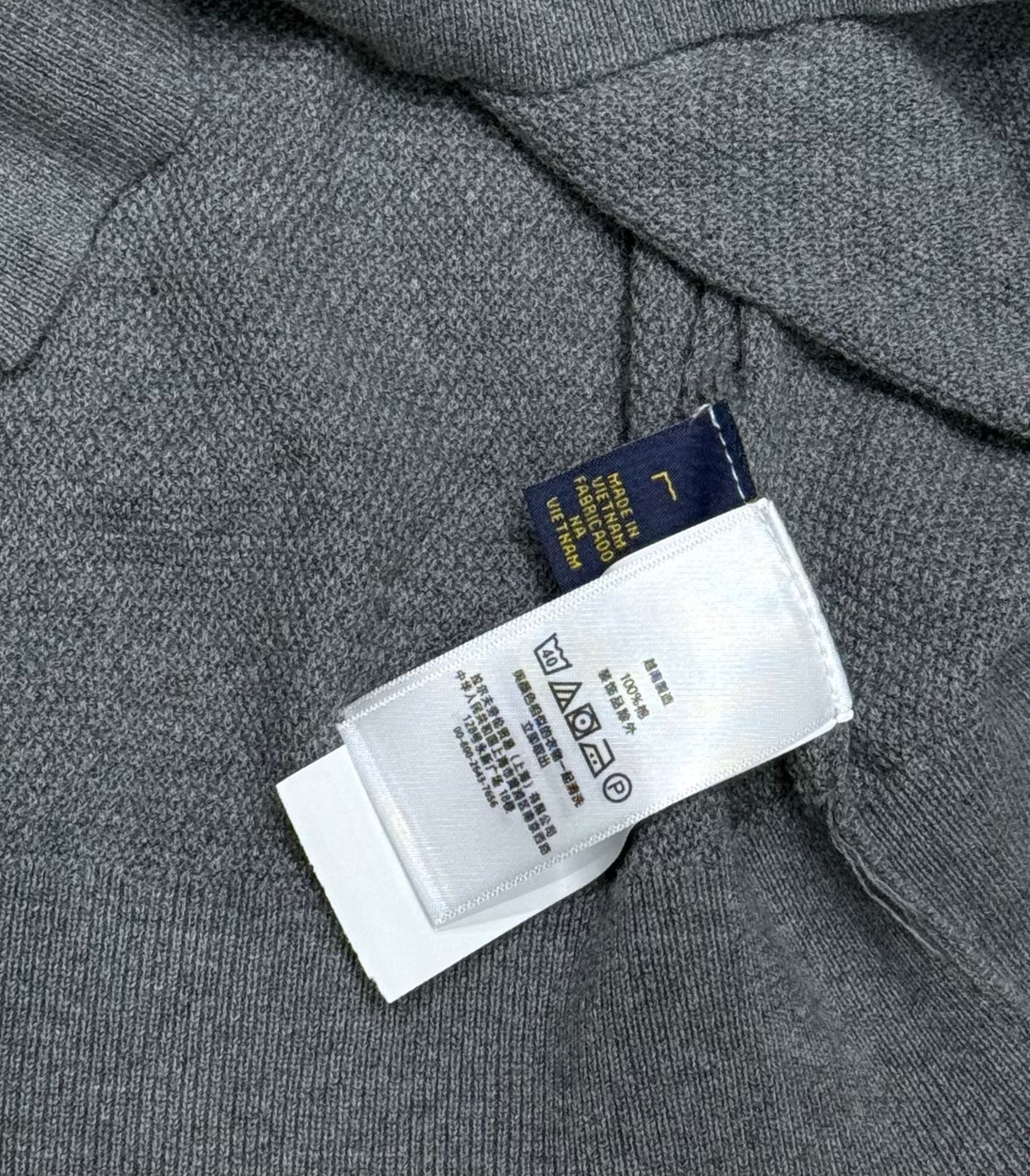 Ralph Lauren polo shirt interior care label and size tag near collar