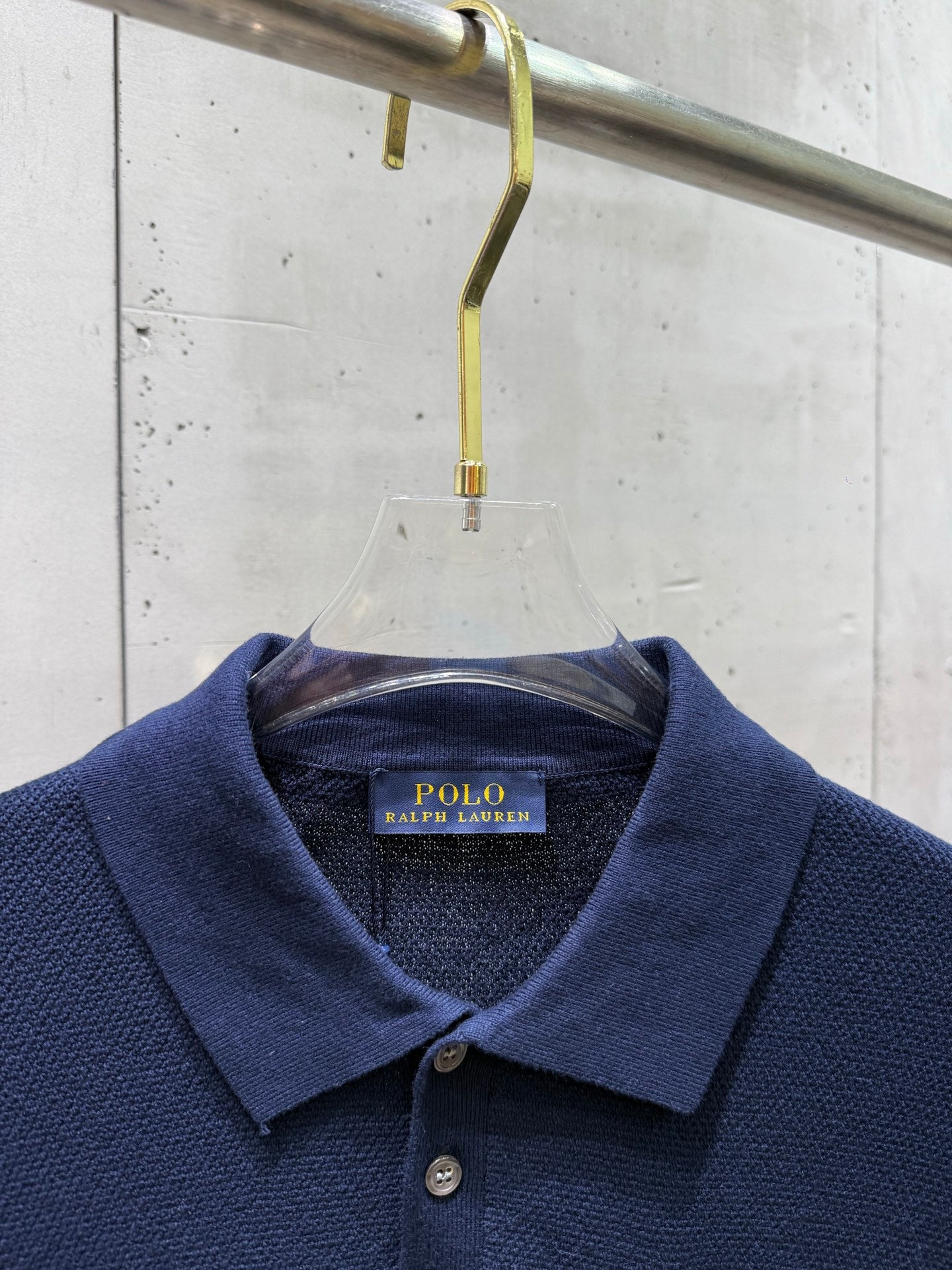 Navy polo collar and placket with Polo Ralph Lauren neck label