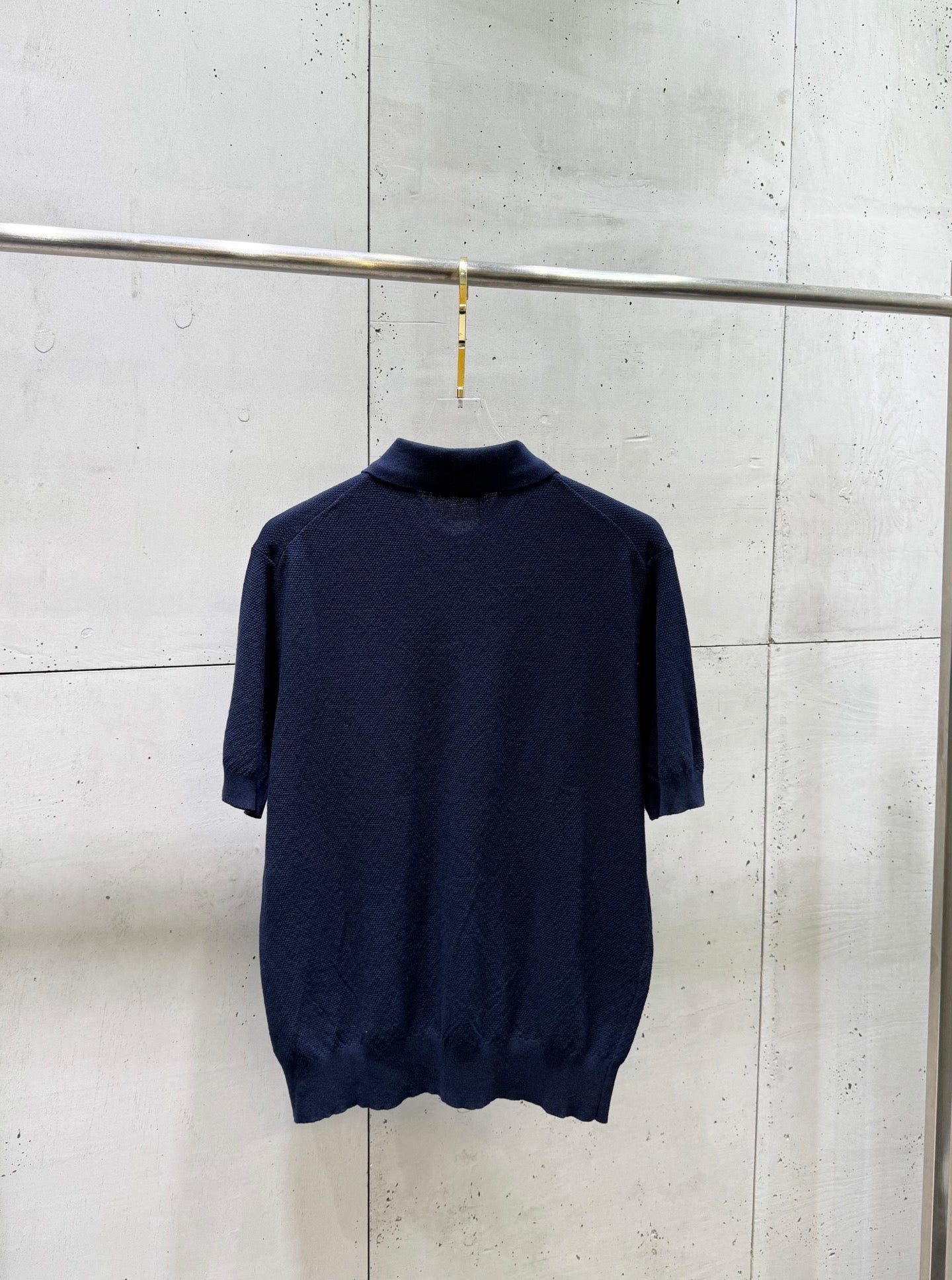 Navy knit polo sweater back with ribbed collar and short sleeves