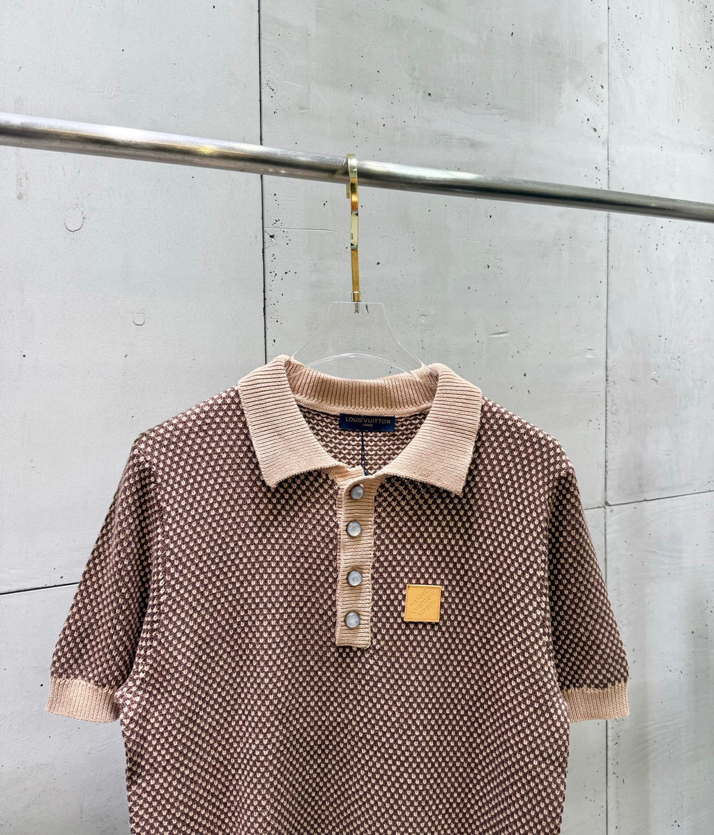Knit polo shirt with ribbed collar, button placket, small patch at chest, short sleeves