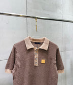 Knit polo shirt with ribbed collar, button placket, small patch at chest, short sleeves