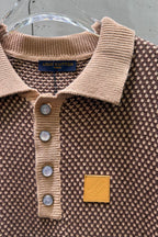 Knit polo shirt neckline detail with ribbed collar, button placket, chest logo patch