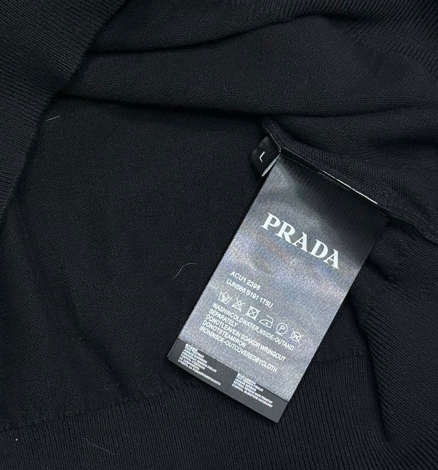 PRADA apparel tag on the inside collar area