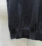 Black polo shirt hem and sleeve cuffs in knit fabric