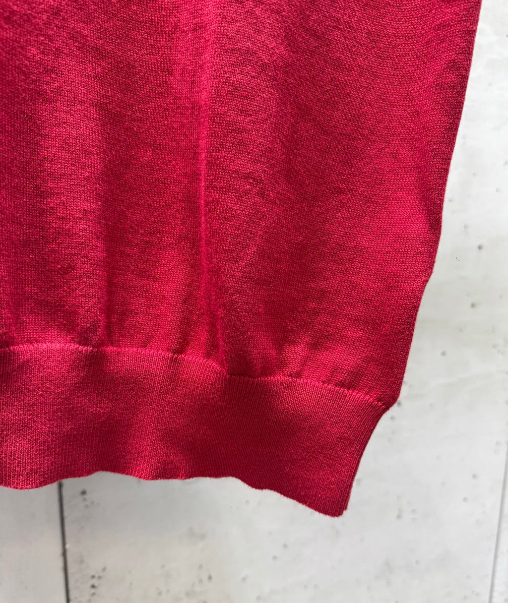 Prada red polo shirt bottom hem with ribbed trim