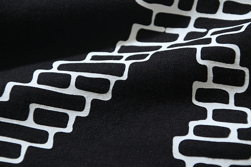 Black T-shirt with white brick-style X graphic detail