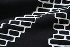 Black T-shirt with white brick-style X graphic detail