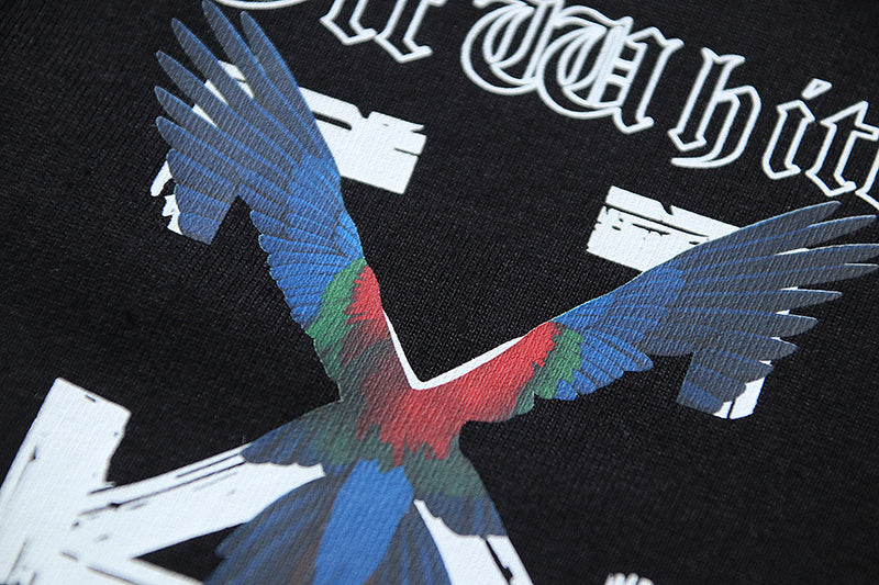 Black T-shirt with colorful bird wing graphic on the front