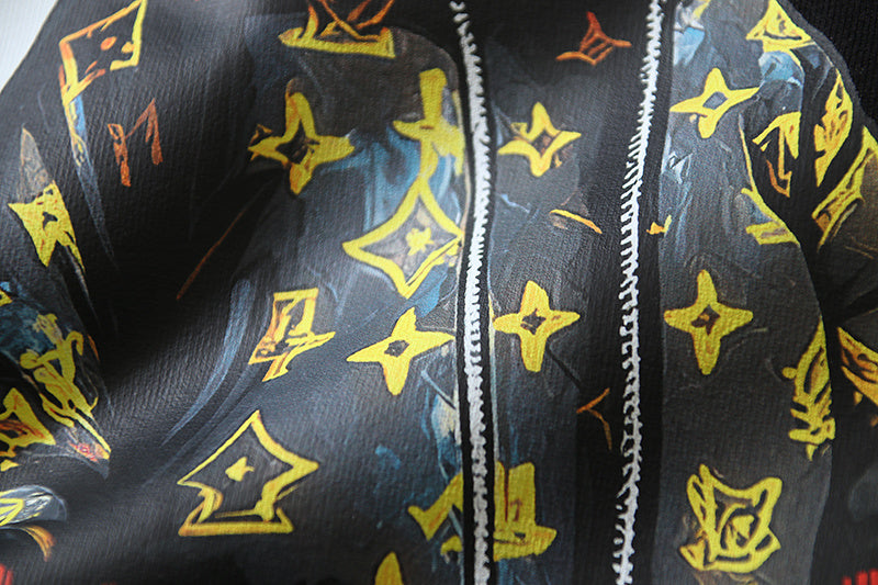 Black T-shirt close-up of character outfit with yellow stars and stripe detail