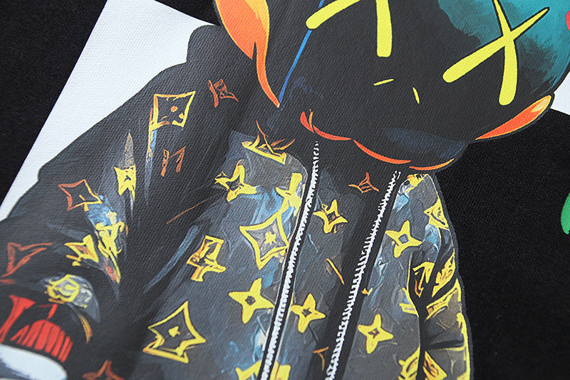Black T-shirt with character face, colorful star pattern, and zip-like stripes