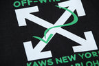 Black T-shirt with large white letter graphic and green accent lines