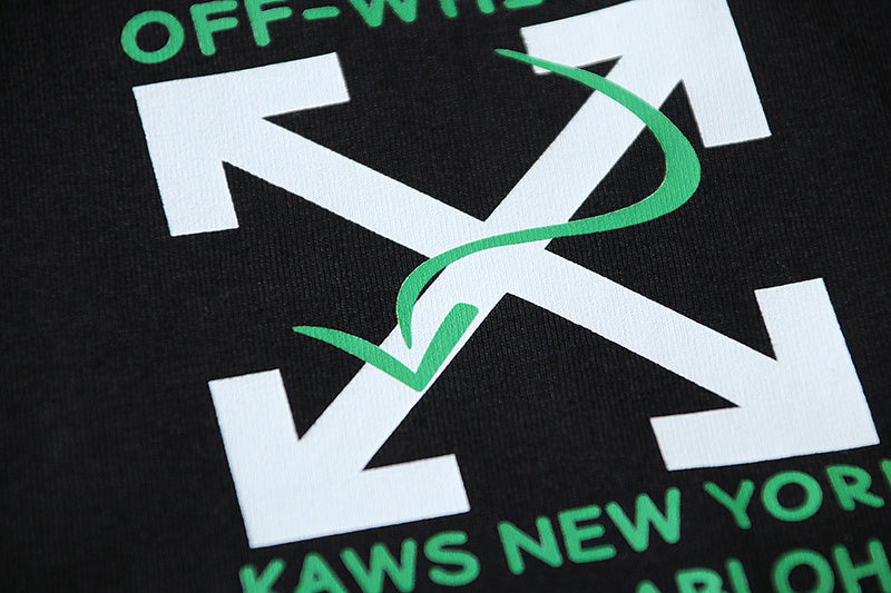 Black T-shirt with large white letter graphic and green accent lines