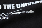 Black T-shirt sleeve print with partial text and graphic detail