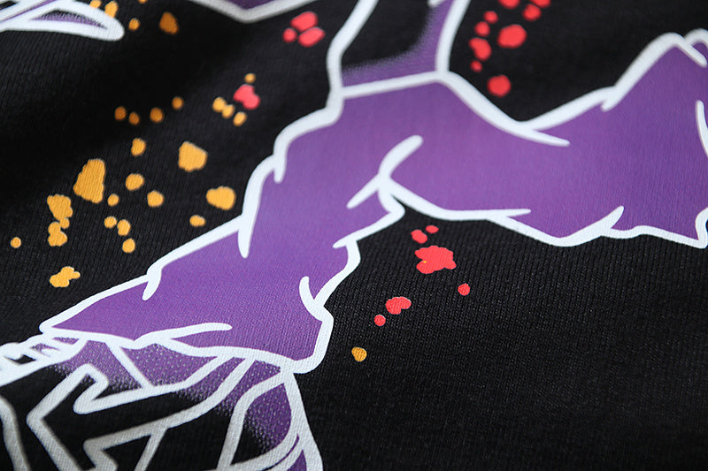 Black T-shirt front graphic with purple shapes and multicolor paint splatter