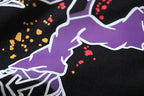 Black T-shirt front graphic with purple shapes and multicolor paint splatter