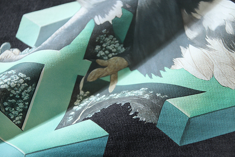 Bird-themed graphic print on dark T-shirt with turquoise blocks
