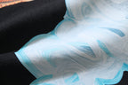 White T-shirt with large blue abstract graphic print near the chest