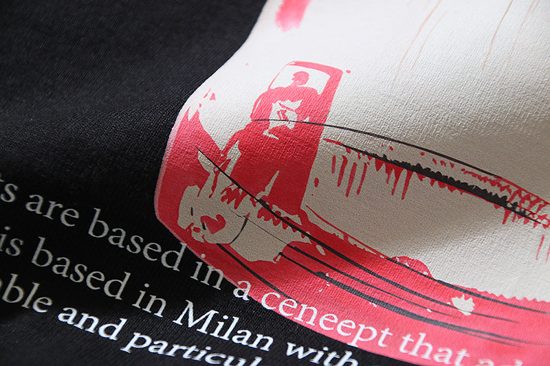 T-shirt sleeve detail with red and white graphic text and line art