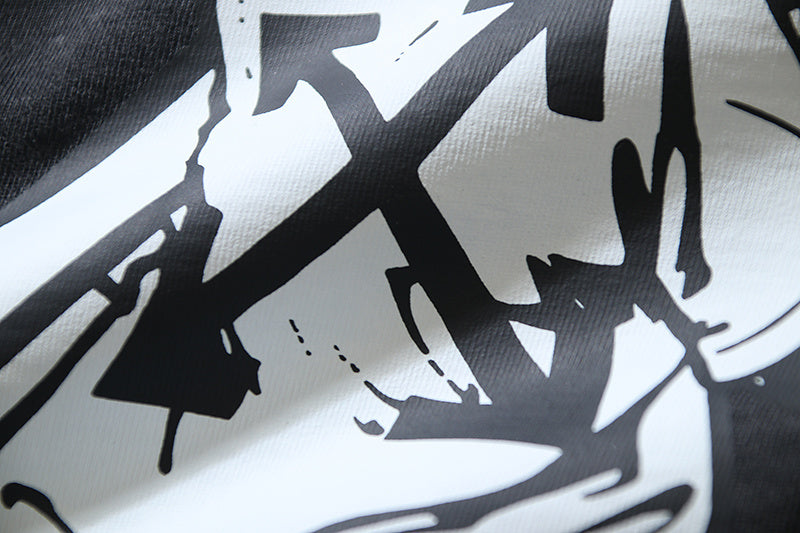 Close-up of oversized white graphic print on dark gray T-shirt