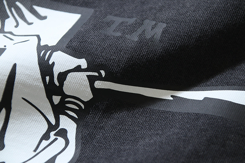 Close-up of white graphic print on dark gray T-shirt fabric