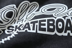 Black T-shirt with large white skate-themed logo text graphic on chest