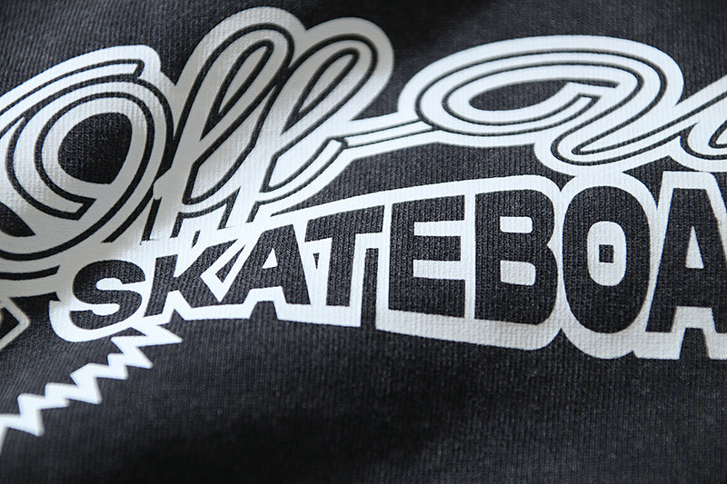 Black T-shirt with large white skate-themed logo text graphic on chest