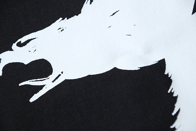 Close-up of bird graphic print on a dark T-shirt