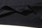 Black T-shirt fabric fold with stitching along the hem