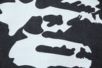 Large distressed silhouettes on light-and-dark graphic print T-shirt