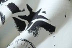 Close-up of white and black distressed graphic print on T-shirt fabric