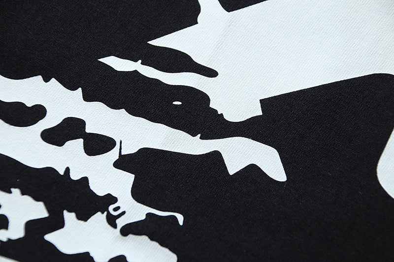 Off-White graphic T-shirt print detail with black silhouettes on off-white