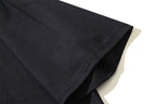 Black T-shirt folded hem detail with stitched edge