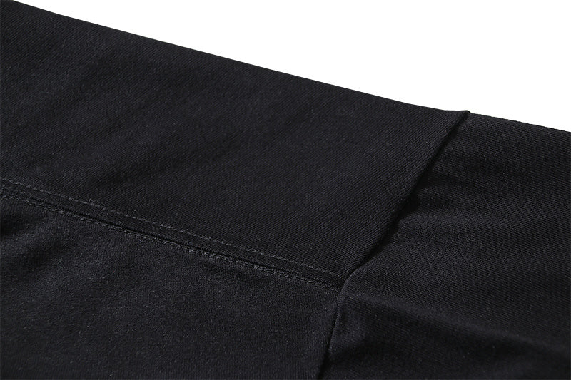 Off-White T-shirt side seam and hem stitching on dark fabric