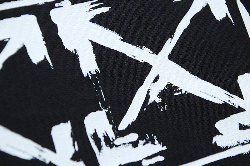 Off-White star graphic print on black shorts fabric