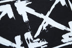 Off-White star graphic print on black shorts fabric