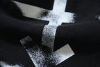 Black shorts with large white star logo print