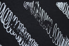 Off-White logo print on black fabric close-up