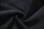 Dark knit fabric draped in folds
